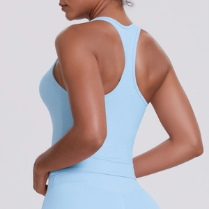Detail of light blue racerback sports vest showing ergonomic cut and elastic fabric