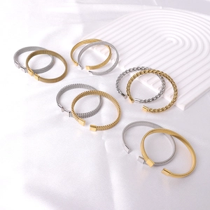 Set of woven and twisted stainless steel open bangles in gold and silver finish