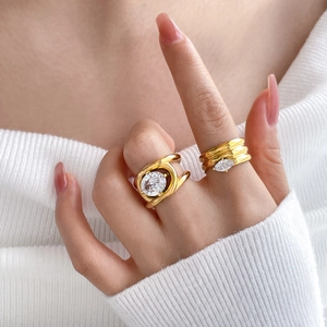 Macro shot of gold-plated multi-layer spiral rings with oval and marquise cubic zirconia