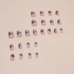 Cat eye press-on nails with butterfly patterns and pink gradient almond shape