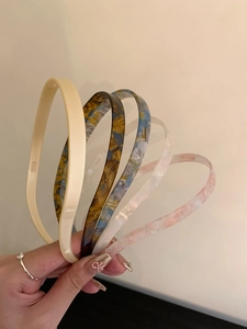 Set of five tortoiseshell acrylic headbands with narrow width and smooth edges