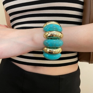 Detail of acrylic turquoise marble resin and gold metal chunk chunky stretch bracelet