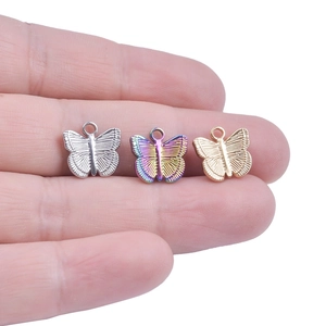 Three butterfly-shaped stainless steel pendants in silver, gold, and rainbow colors
