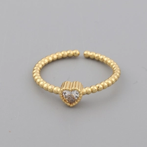 Detail of 18k gold plated open ring featuring a heart-shaped zircon and beaded band