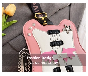 Detailed close-up of pink guitar-shaped crossbody bag with silver studs and rhinestone star