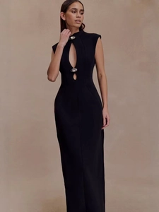 Detail of black cutout maxi dress with sleeveless design and decorative buttons