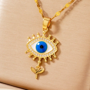 Detailed close-up of blue evil eye pendant with gold wings and white zircon stones
