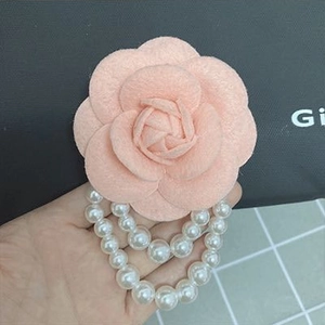 Elegant pink fabric camellia brooch featuring double-layer pearl tassel charms for women