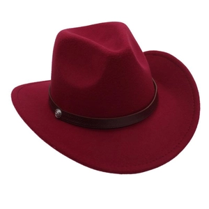 Detail of dark red felt cowboy hat with brown leather band and silver metal studs