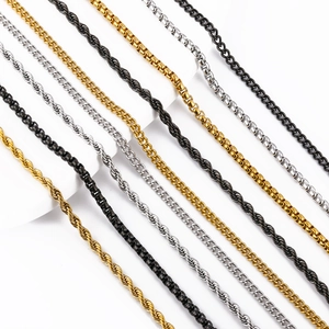 Detail of stainless steel twist, box, and curb chains in gold, silver, and black tones