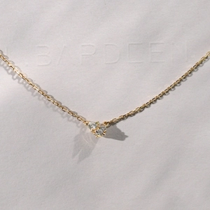 Close-up of 18K gold-plated 925 silver necklace with three small zircon stones