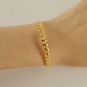 Minimalist gold stainless steel adjustable open bangle featuring a geometric round disk design