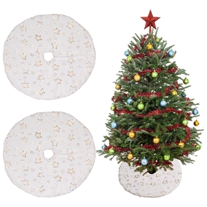 Detail of white plush Christmas tree skirt featuring shiny golden star embroidery