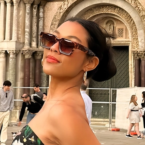 Outdoor shot of stylish tortoiseshell square oversized sunglasses with brown gradient lenses