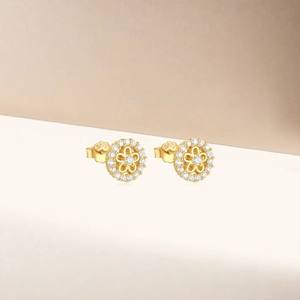 Detailed close-up of S925 sterling silver gold flower stud earrings with pavé zircon stones