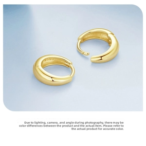 Macro detail of gold plated S925 sterling silver hoop earrings with clear hallmark stamp