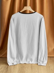 Detail view of cotton linen shirt showing drop shoulder design and natural fabric texture