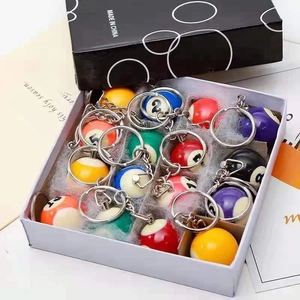 Set of 16 miniature billiard ball keychains in resin with numbered balls in a display box