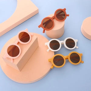 Kids round frame candy colored sunglasses in pink, orange, ivory and yellow matte finish