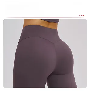 Close-up of high-waisted deep purple yoga pants featuring a V-shaped butt-lifting seam design