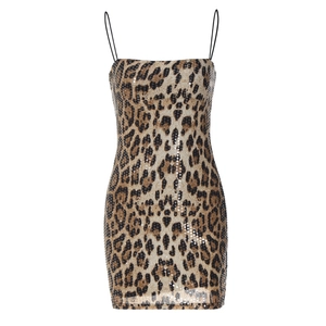 Close-up detail of leopard print sequined fabric and slim strap on summer dress