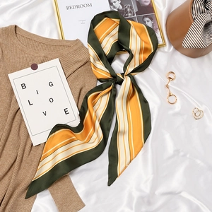 Retro French striped silk scarf in green and orange styled with chic fashion accessories