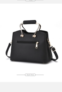 Rear view of black lychee texture handbag with zipper pocket and golden hardware details