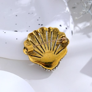 Retro golden shell brooch with rhinestones, back view showing secure pin clasp