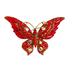 Sparkling gold butterfly brooch with vibrant red rhinestones and iridescent AB crystals