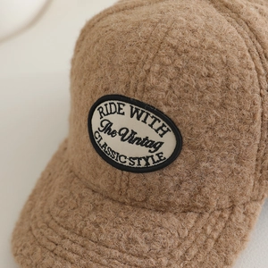 Brown fleece baseball cap for kids with vintage oval embroidery patch and warm teddy fabric