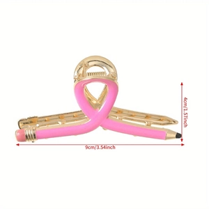 Pink and gold creative pencil hair claw clip with dimensions shown on white background