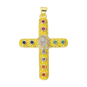 Macro detail of gold cross pendant with colorful gemstones and textured metal finish