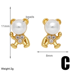 Detail view of 18k gold plated bear stud earrings with beads and 11mm by 8mm dimensions