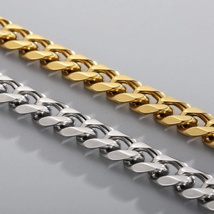 Macro shot of gold and silver cuban link chains showing polished metal textures