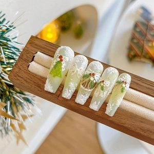 3D embossed Christmas nail stickers with green wreath and white snowflake texture