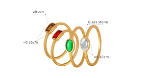 Macro detail of minimalist gold-plated rings with colorful zircon and glass stone inlays