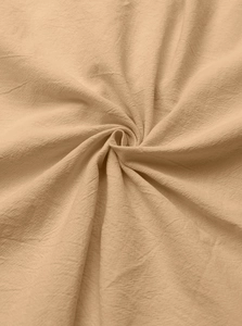Close-up of beige cotton-linen fabric texture with breathable waffle weave pattern