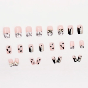 Press-on nails featuring black plaid, pearl 3D bows, hearts and gradient glitter finish