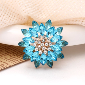 Macro shot of sky blue and white sunflower crystal charm with multi-layer petals