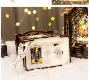 Detail of Christmas lantern base showing USB port, battery compartment and power switch