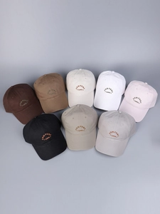 Detail of embroidered Comfort Zones text on cotton baseball caps in multiple colors