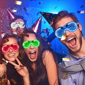 Group of people wearing colorful LED shutter glasses in red white green and blue party setting