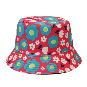 Red sun flower bucket hat with blue and white floral print on a white background