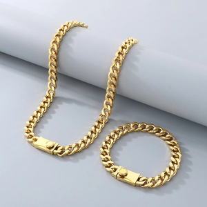 Detail of gold Cuban link chain necklace and bracelet with square box clasp closure