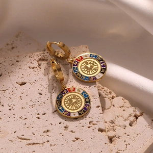 Bohemian gold evil eye hoop earrings with colorful enamel charms on stone and silk