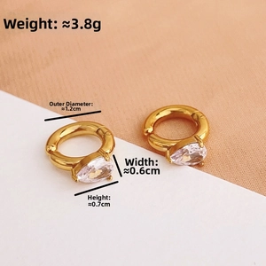 Detail of gold titanium steel ear clips with sparkling teardrop zircon pendants