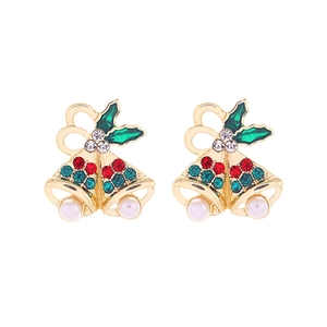 Detailed macro of Christmas bell earrings with colorful rhinestones and white pearls