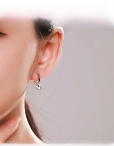 Close-up of elegant S925 sterling silver hoop earring with a sparkling round zircon stone