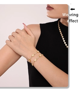 Close-up of 18K gold plated stainless steel zircon bracelet worn by a model