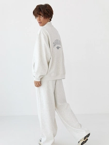 Detail of grey marl tracksuit showing oversized hoodie with BADBLOOD embroidery and pants